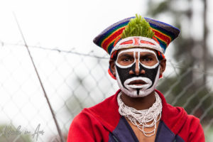 Portrait: Western Highlands man in partial face paint, Mt Hagen Cultural Show, PNG