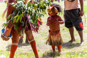 Toddler in a grass skirt and face piant, Mt Hagan Cultural Show, PNG