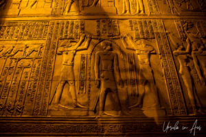 Relief: Thoth and Horus pouring sacred water over the pharaoh, Kom Ombo Temple after dark, Egypt