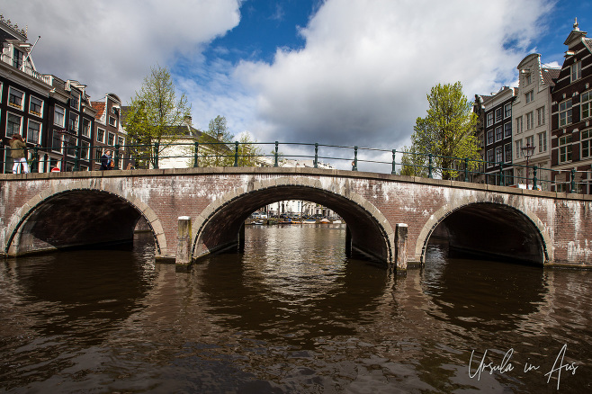 Arched stone bridges on a canal, Amsterdam, The Netherlands.
