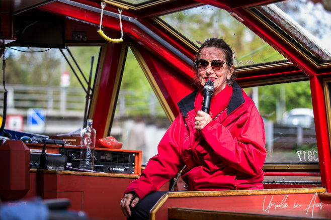 Dutch guide in a red jacket, canal boat, Amsterdam The Netherlands 