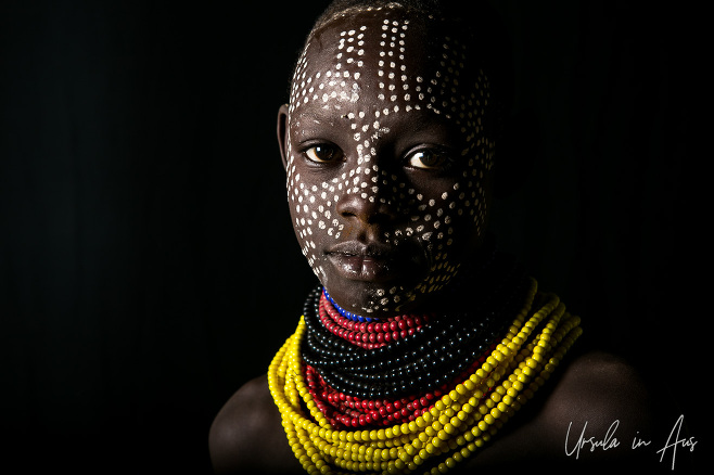 Portrait: Kara youngster against black, Dus Village Ethiopia