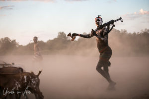 A goatherd with his gun and stool in the dust, Dus Village Ethiopia