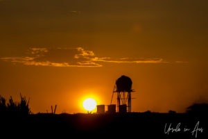 Water tower silhouetted by sunset on the Omo River, Ethiopia