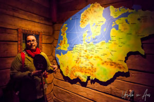 Guide with a map in the Hanseatic Museum, Bergen Norway