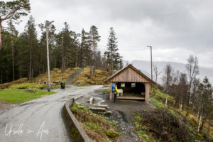 Wooden goathouse in the rain, Mt Fløyen, Norway
