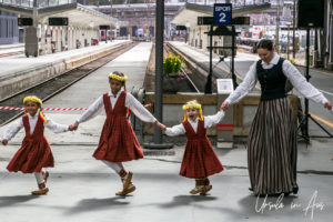 Small Norwegian girls and a female teacher in folk costume, Bergen