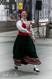 A female Norwegian folk dancer, Bergen train station