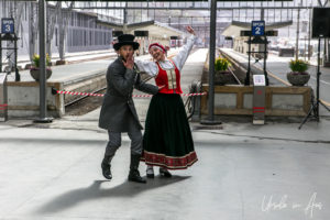 A Norwegian couple folk dancing, Bergen train station