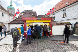 Customers outside the 3 Kroneren Pølsebu sausage stand, Kong Oscar gate Bergen Norway