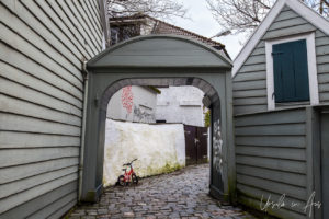 A child's bicycle in a graffitied laneway, Bergen Norway
