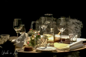 Glassware on a small candlelit table, Bergen Norway