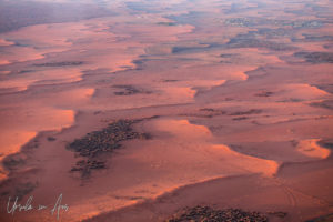 Waves of red sand and rock from the air, Yulara NT Australia