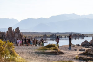 People on the shoreline, Mono Lake Tufa State Natural Reserve, California USA