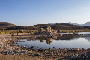 People on the shoreline, Mono Lake Tufa State Natural Reserve, California USA