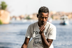 Environmental portrait of a young boatman, Aswan, Egypt