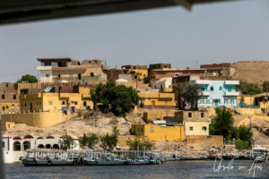 Colourful brick buildings, Nile riverbank, Aswan, Egypt.