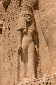 Queen Nefertari under the knee of a Calossi leg, the Great Temple, Abu Simbel Egypt.