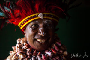 Portrait: Smiling Western Highlands woman in a headdress, Mt Hagen PNG.
