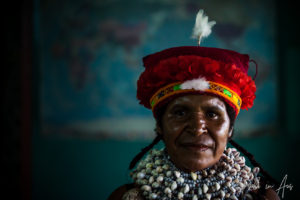 Portrait: Smiling Western Highlands woman in a headdress, Mt Hagen PNG.