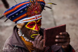 Portrait: Smiling Western Highlands Kunai man face painting, Mt Hagen PNG.