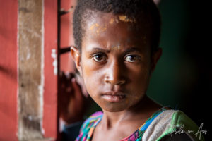 Portrait: Papuan girl at a classroom window, Mt Hagen PNG