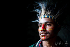 Portrait: Young Papuan man in a feathered headdress, Mt Hagen PNG