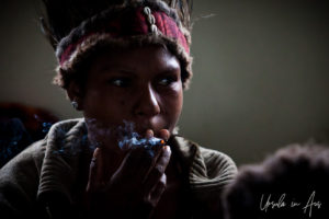 Portrait: Young Western Highlands woman smoking, Mt Hagen PNG