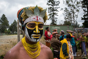 Western Highland man in black and yellow face paint, Mt Hagen, Papua New Guinea