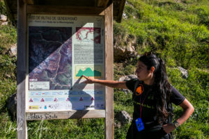 Spanish guide in front of a signboard, Sotres Asturias.