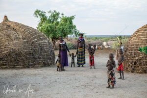 Women and children in a Nyangatom kraal, Omo Valley Ethiopia