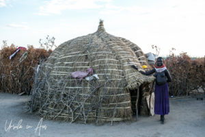 Nyangatom Woman and her beehive hut, Omo Valley Ethiopia