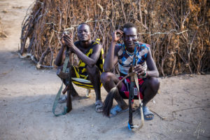 Two Nyangatom men with guns, Omo Valley, Ethiopia