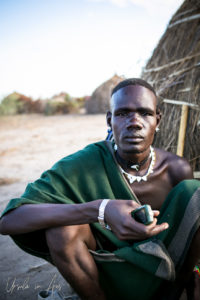 Portrait: Nyangatom man sitting, Omo Valley, Ethiopia