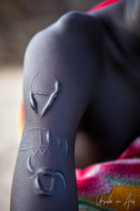 Decorative arm scarring on a Nyangatom man, Omo Valley, Ethiopia