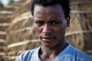 Portrait: Young Man in a Nyangatom village, Omo Valley, Ethiopia