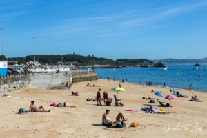 People on Playa Los Peligros, Santander Spain