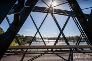 Afternoon sun flare in the trusses of Burnett Bridge, Bundaberg Qld Australia
