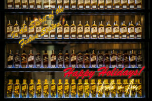 Bundaberg rum bottles with Happy Holidays message text.