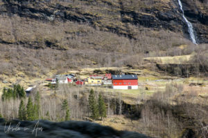 Red-painted wooden buildings in a valley, Flåmsbana, Norway