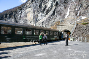 People and a train at the Kjosfossen Station, Norway