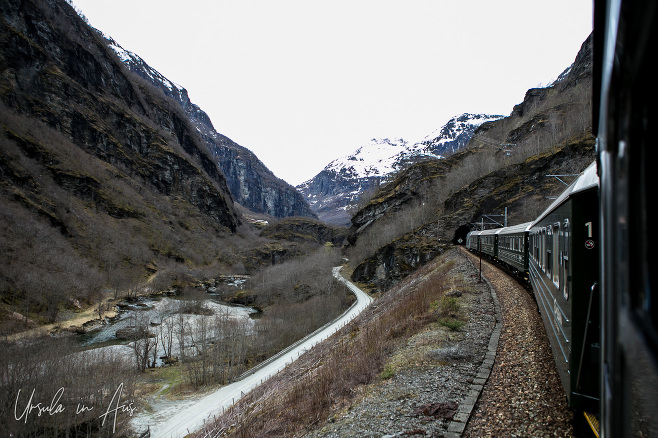 Train going into a tunnel on the Flåmsbana, Norway