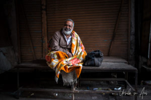 Portrait: Man in an orange blanket, Haridwar India