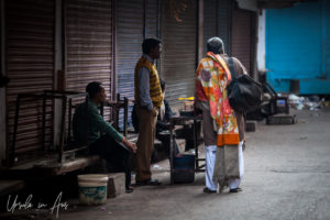 Three men in a Haridwar street, India