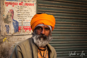 Portrait:Sadhu in an orange turban and grey beard, Haridwar India.