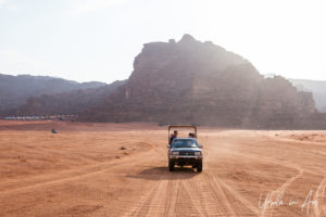 Tourists on the back of open trucks, Wadi Rum, Jordan