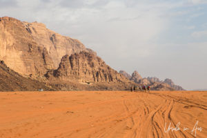 Tourists camel-riding in Wadi Rum, Jordan