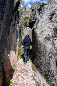A guide walking into a Q'enqo corridor, Cusco, Peru