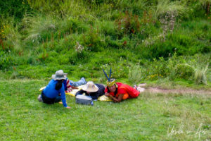 Peruvian people on the grass, Q'enqo, Cusco, Peru