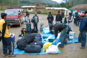 Porters bundle the packs, the Inca Trail, Peru